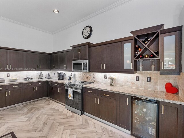 kitchen featuring backsplash, stainless steel appliances, light parquet floors, and beverage cooler