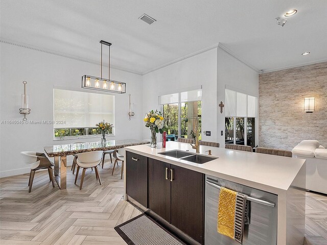 kitchen featuring dark brown cabinetry, sink, wine cooler, a kitchen island with sink, and light parquet floors