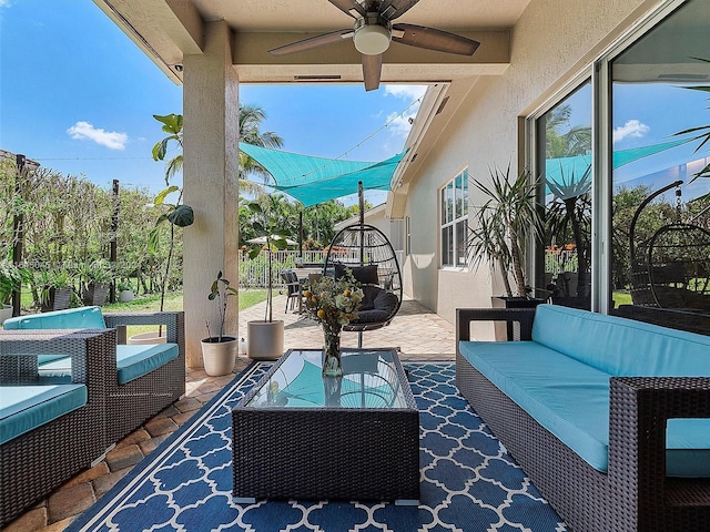 view of patio with outdoor dining area, a ceiling fan, and outdoor lounge area