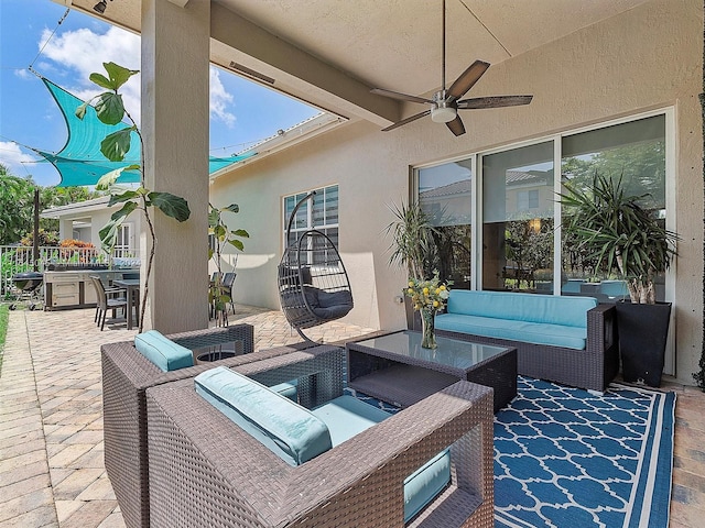 view of patio featuring an outdoor living space, outdoor dining area, and ceiling fan