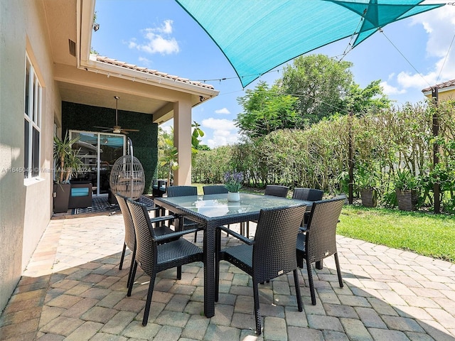 view of patio / terrace featuring outdoor dining area and ceiling fan