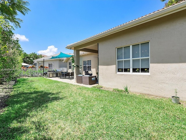 view of yard featuring a patio and outdoor lounge area