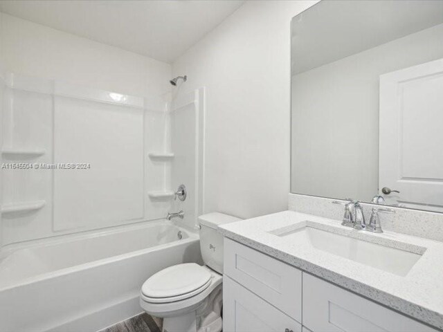 full bathroom with vanity, toilet, shower / bathtub combination, and hardwood / wood-style flooring