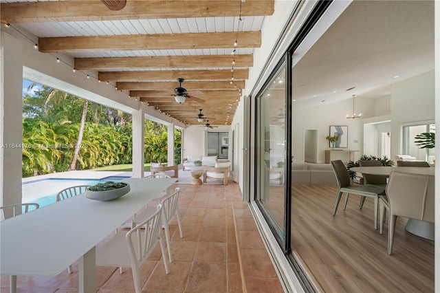 balcony with a ceiling fan and outdoor dining space