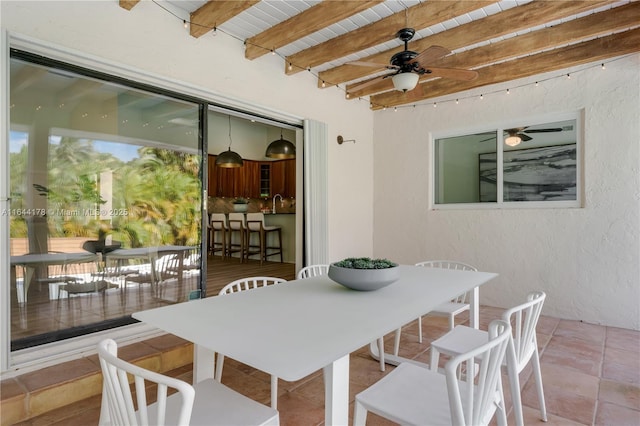 view of patio / terrace with ceiling fan, outdoor dining area, and a sink