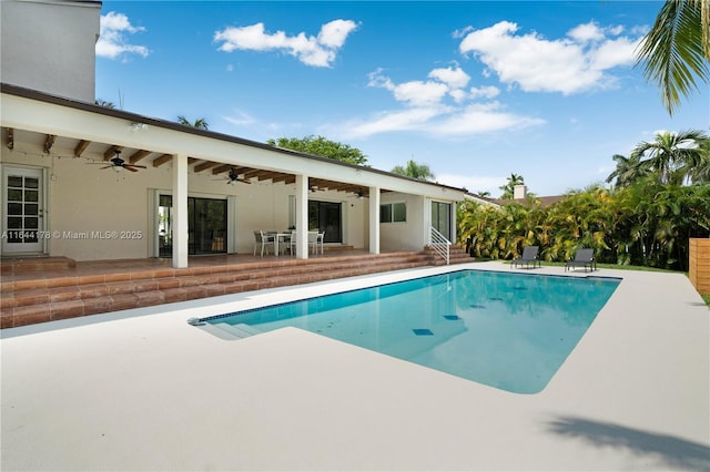 outdoor pool featuring entry steps, a patio, and ceiling fan