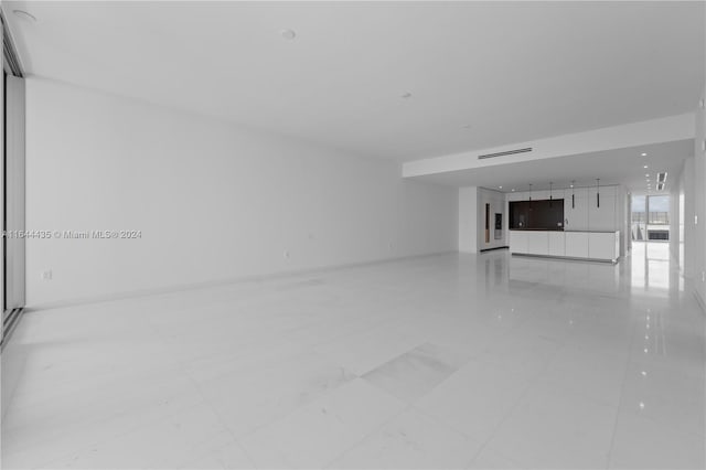 spare room featuring light tile patterned floors