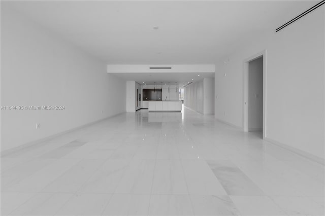 unfurnished room featuring light tile patterned floors