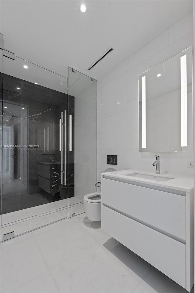 bathroom featuring tile walls, walk in shower, toilet, and vanity