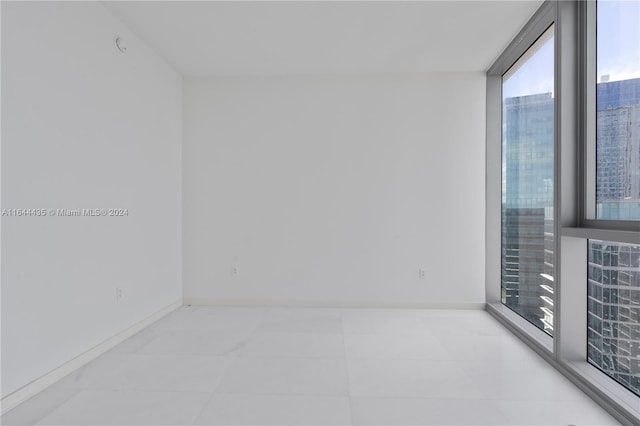 300 Biscayne Blvd Way Unit 4204, Miami, FL 33131 - empty room with baseboards and floor to ceiling windows