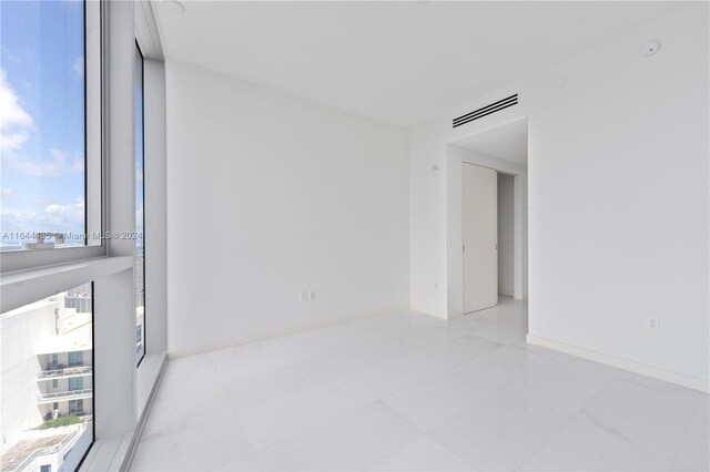 unfurnished room with plenty of natural light