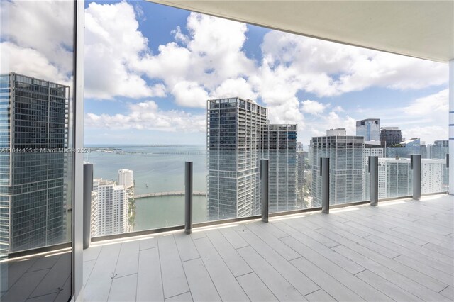 balcony featuring a water view