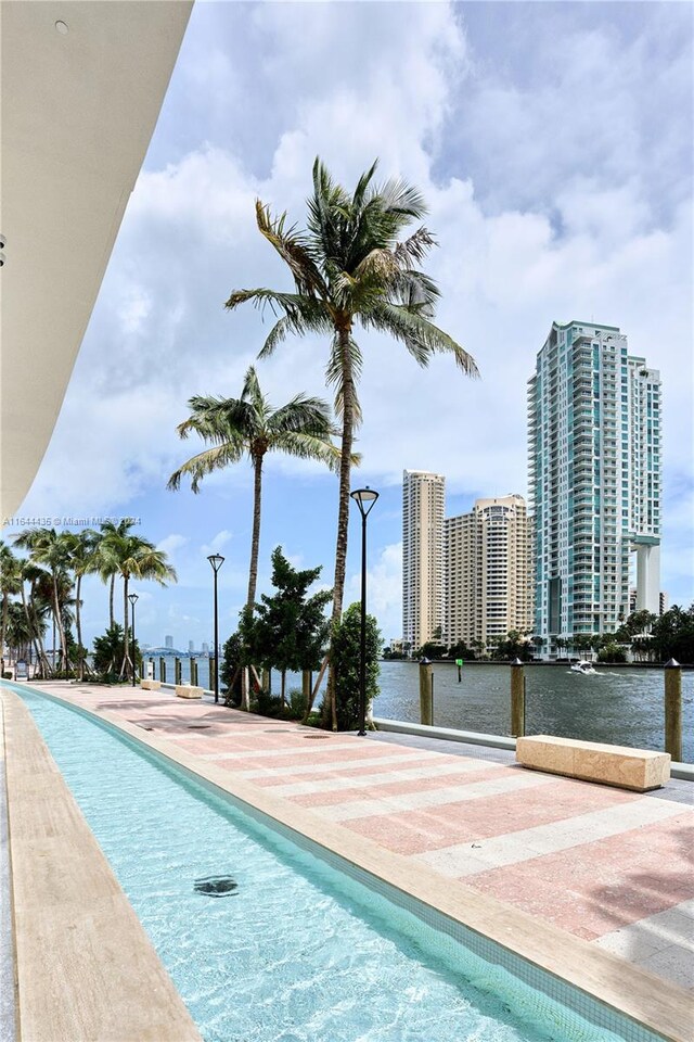 view of pool with a water view