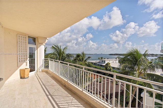 balcony featuring a water view