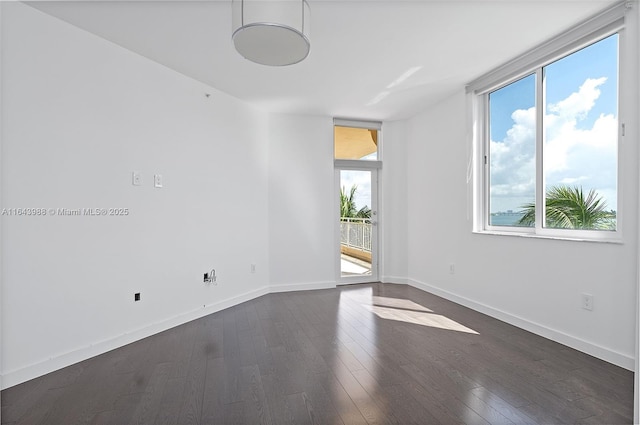 unfurnished room featuring dark hardwood / wood-style floors