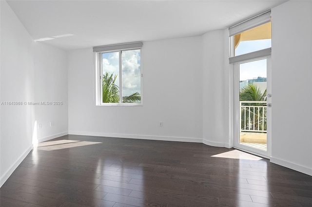 unfurnished room featuring dark wood-type flooring