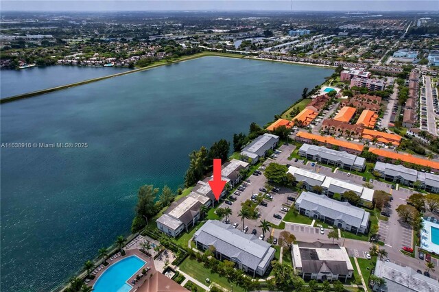 468 NE 206th Ln Unit 105, Miami, FL 33179 - bedroom featuring a closet, a textured ceiling, light tile patterned floors, baseboards, and ceiling fan