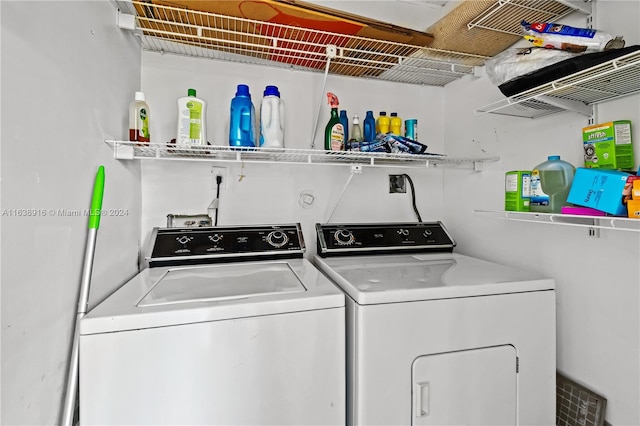 laundry room featuring washing machine and clothes dryer