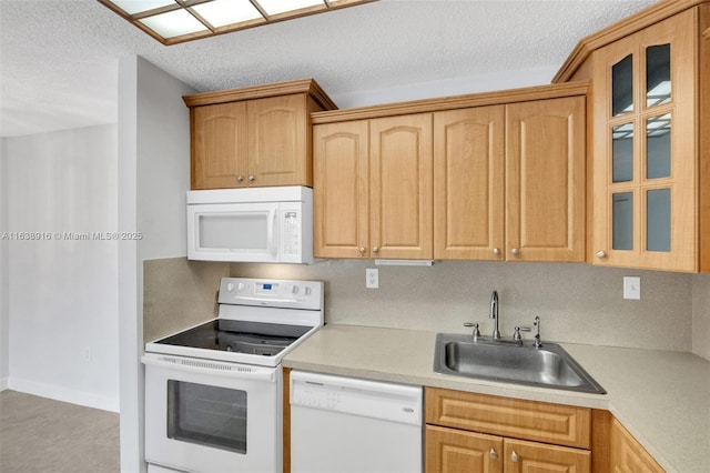 468 NE 206th Ln Unit 105, Miami, FL 33179 - kitchen featuring white appliances, light countertops, glass insert cabinets, and a sink