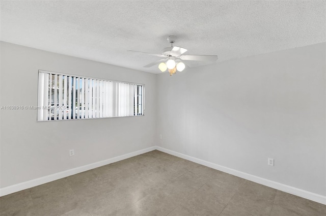 468 NE 206th Ln Unit 105, Miami, FL 33179 - empty room featuring baseboards, a textured ceiling, and a ceiling fan
