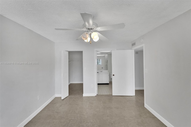 468 NE 206th Ln Unit 105, Miami, FL 33179 - unfurnished room with baseboards, a textured ceiling, and a ceiling fan