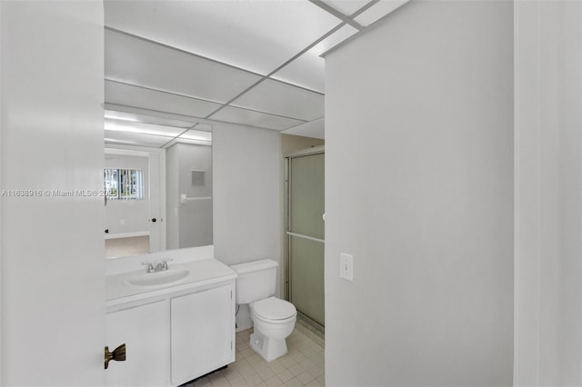 468 NE 206th Ln Unit 105, Miami, FL 33179 - bathroom featuring a stall shower, tile patterned floors, toilet, vanity, and a drop ceiling