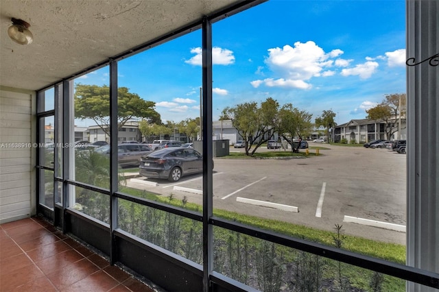 468 NE 206th Ln Unit 105, Miami, FL 33179 - unfurnished sunroom featuring a residential view