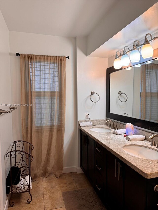 bathroom with tile patterned floors and vanity