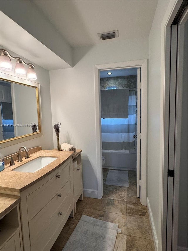 full bathroom featuring shower / bathtub combination with curtain, vanity, and toilet