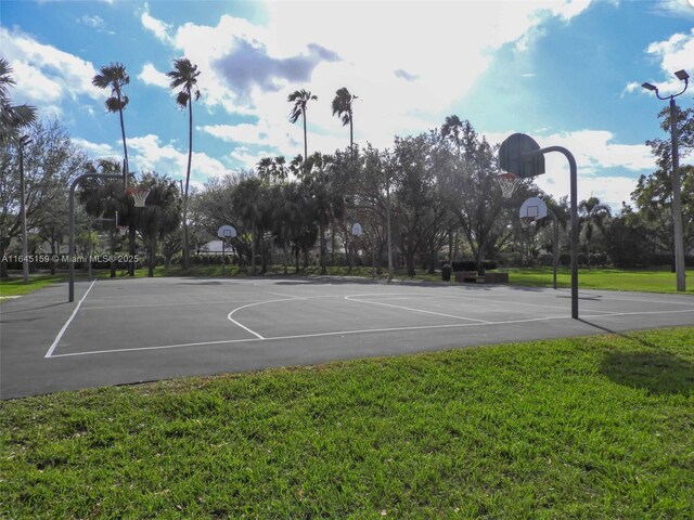 view of basketball court featuring a yard