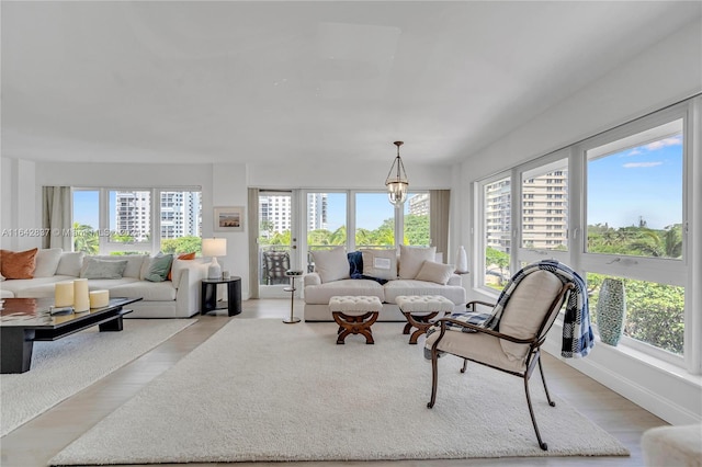 living room featuring light hardwood / wood-style flooring and a healthy amount of sunlight