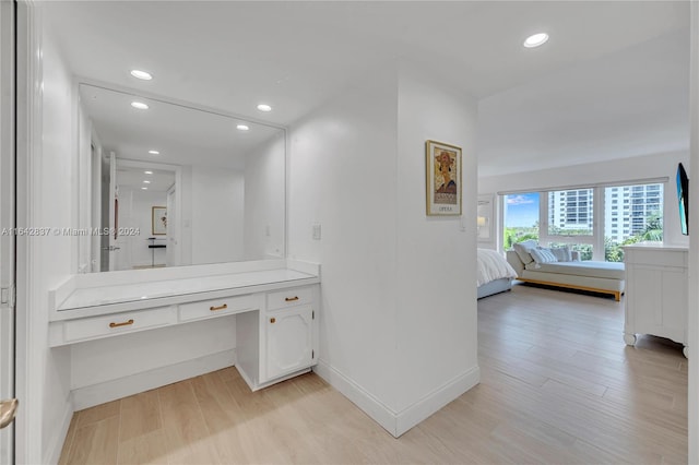 bathroom with hardwood / wood-style floors and vanity