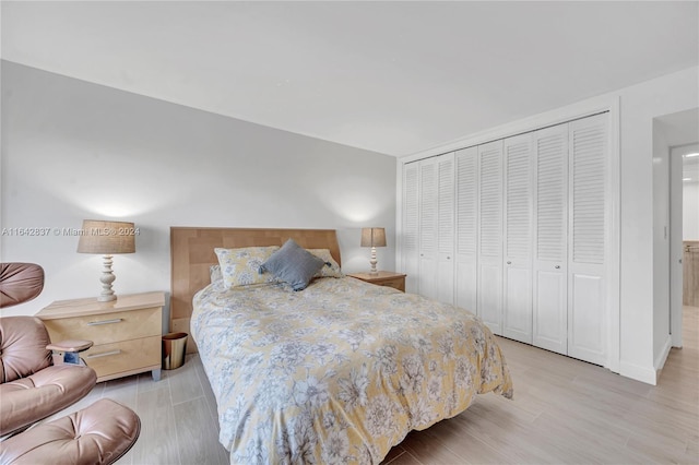 bedroom featuring light hardwood / wood-style flooring and a closet