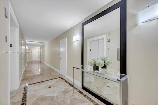 hallway featuring light tile patterned floors