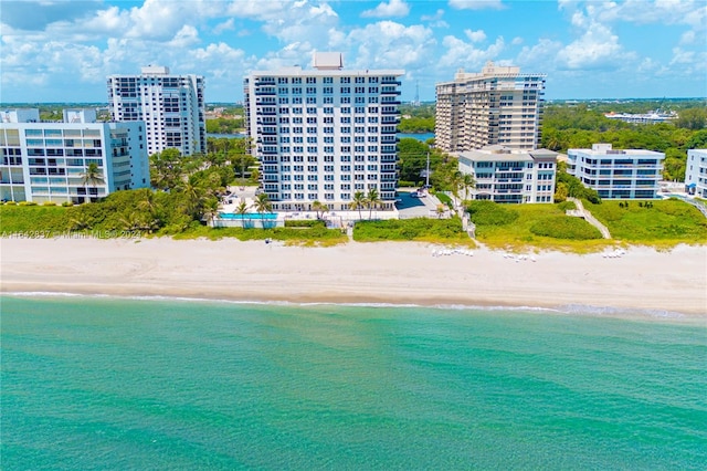 bird's eye view with a beach view and a water view