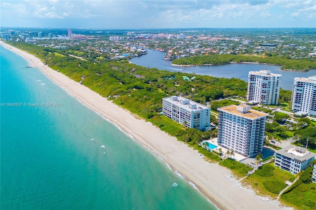 drone / aerial view with a water view and a view of the beach