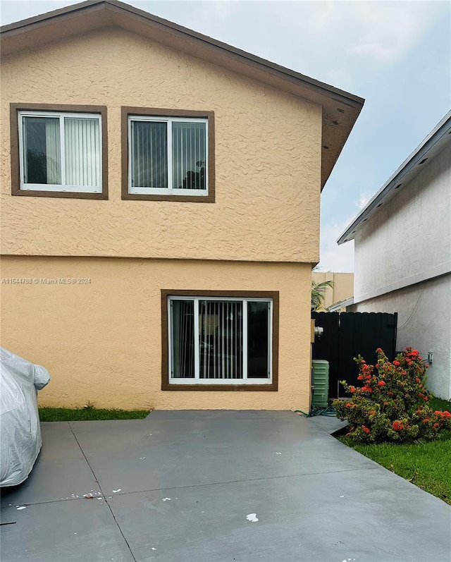 rear view of house featuring a patio area