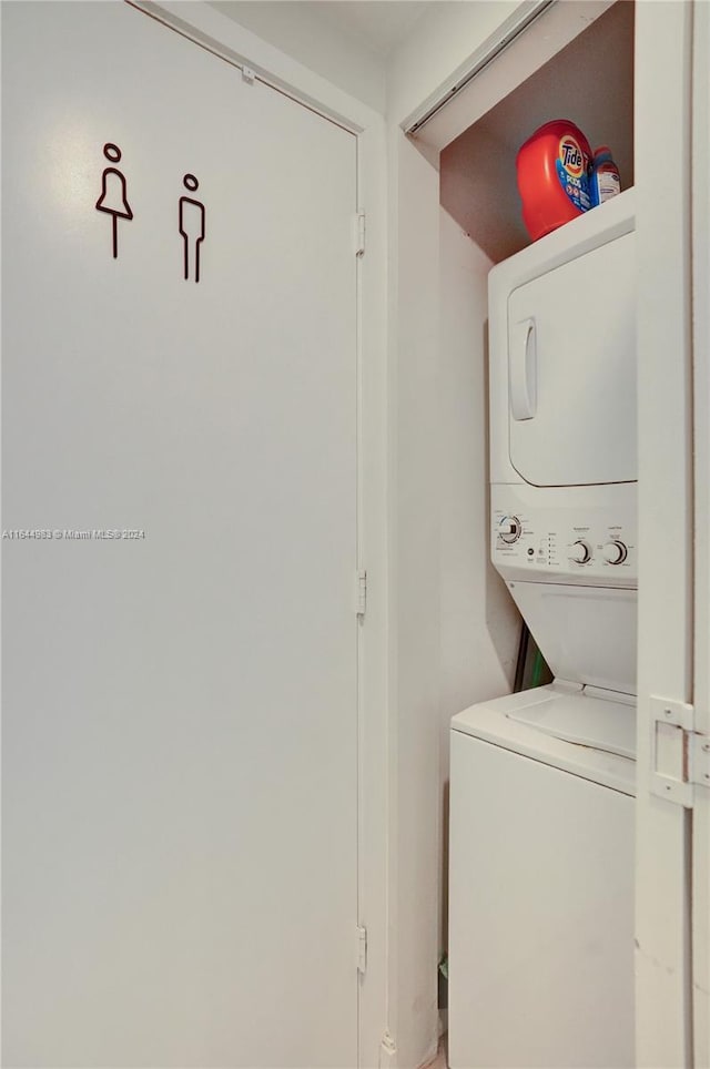 laundry area with stacked washer and clothes dryer