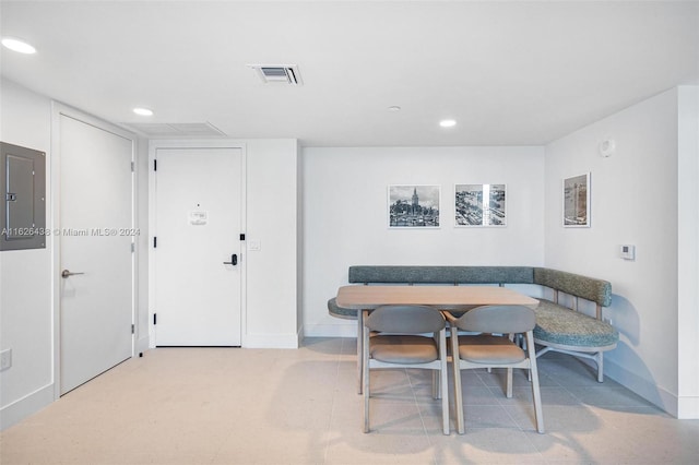 dining room featuring electric panel and breakfast area