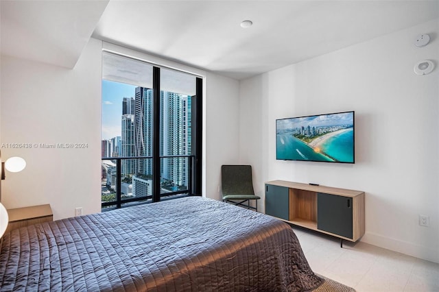 bedroom featuring floor to ceiling windows and multiple windows