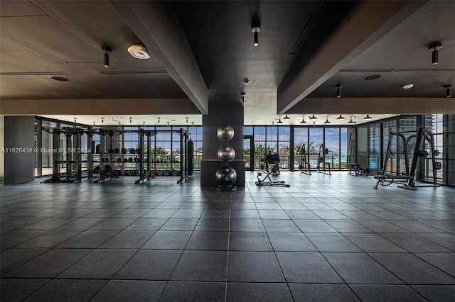 workout area featuring floor to ceiling windows