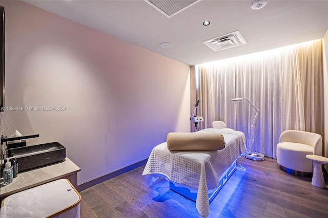 bedroom featuring dark hardwood / wood-style floors