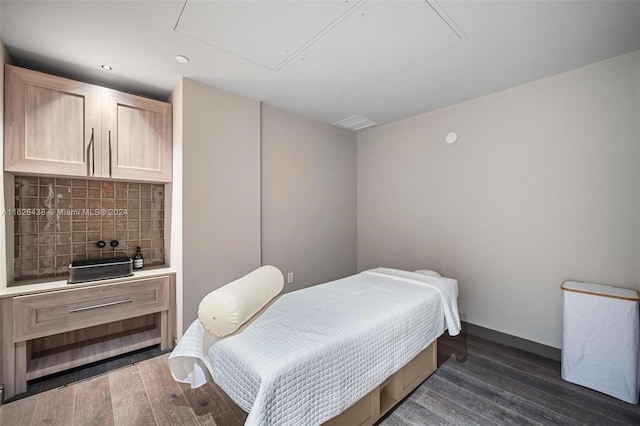 bedroom with dark wood-type flooring