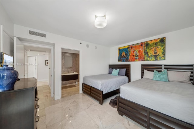 bedroom featuring marble finish floor, baseboards, visible vents, and connected bathroom