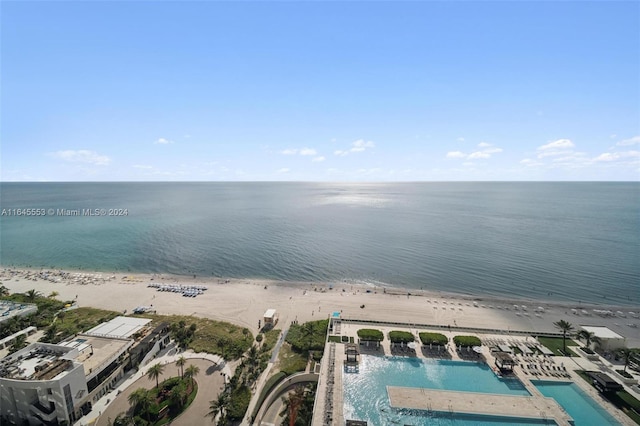 birds eye view of property with a view of the beach and a water view