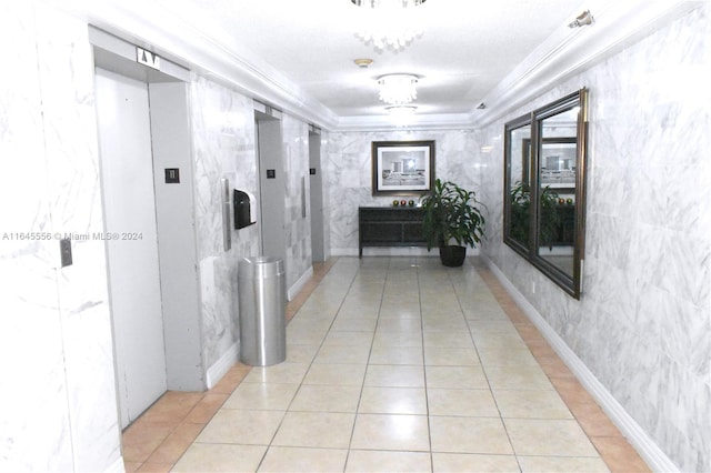 hall featuring light tile patterned floors, a raised ceiling, and elevator