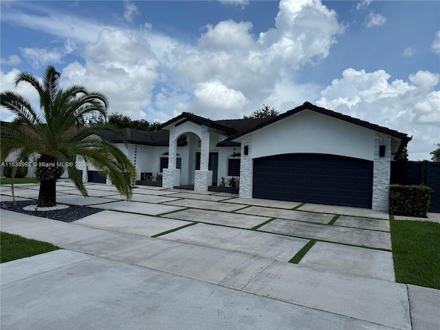 mediterranean / spanish-style house with a garage