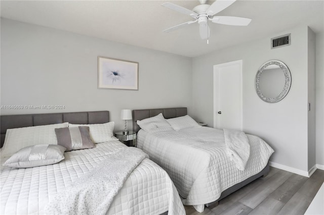 bedroom featuring ceiling fan and hardwood / wood-style flooring