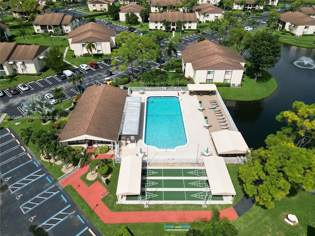 view of swimming pool with a water view