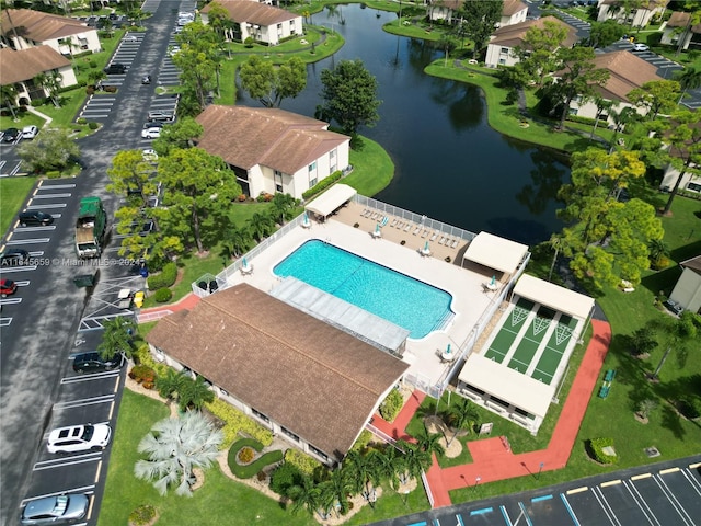 birds eye view of property with a water view